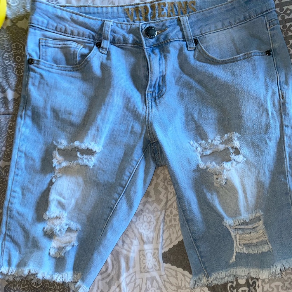 Woman’s ripped Bermuda shorts